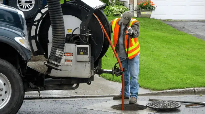 Technician using specialized drainage equipment for sewer line cleaning and foundation protection in Staten Island, NY